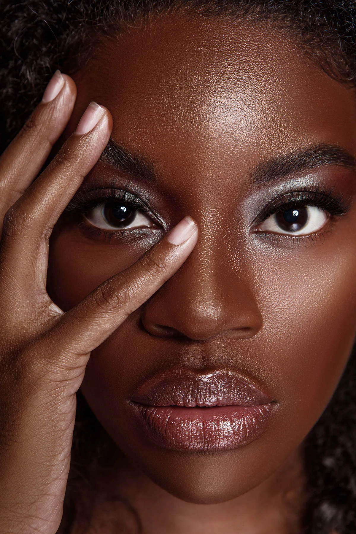Beauty close-up, hand gesture, deep tone skin