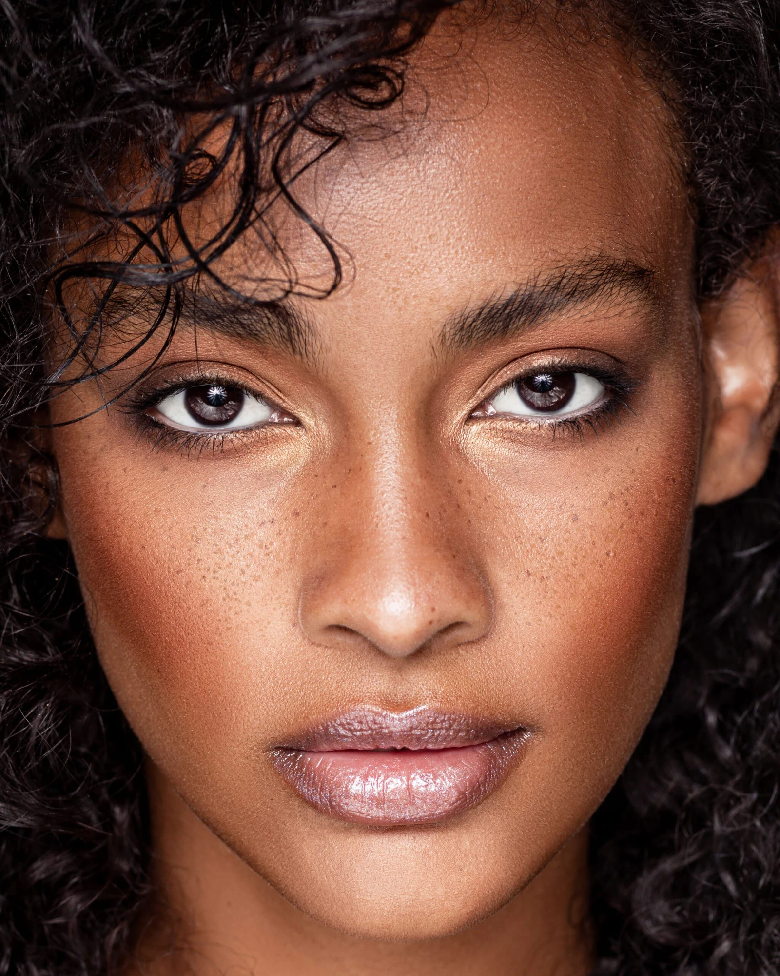 Beauty close-up, deep tone skin, rose detail