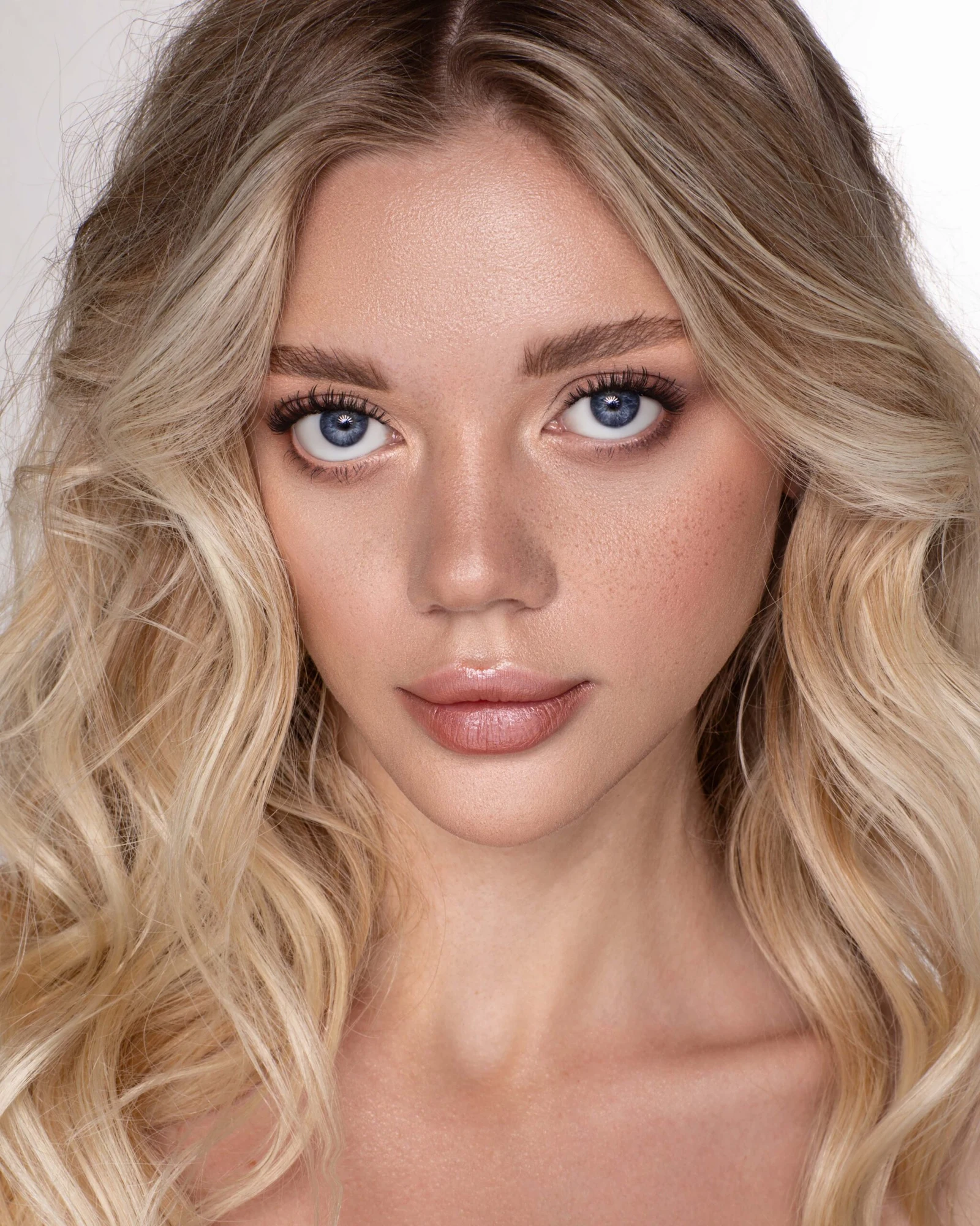 Beauty close-up, natural red curls and freckles