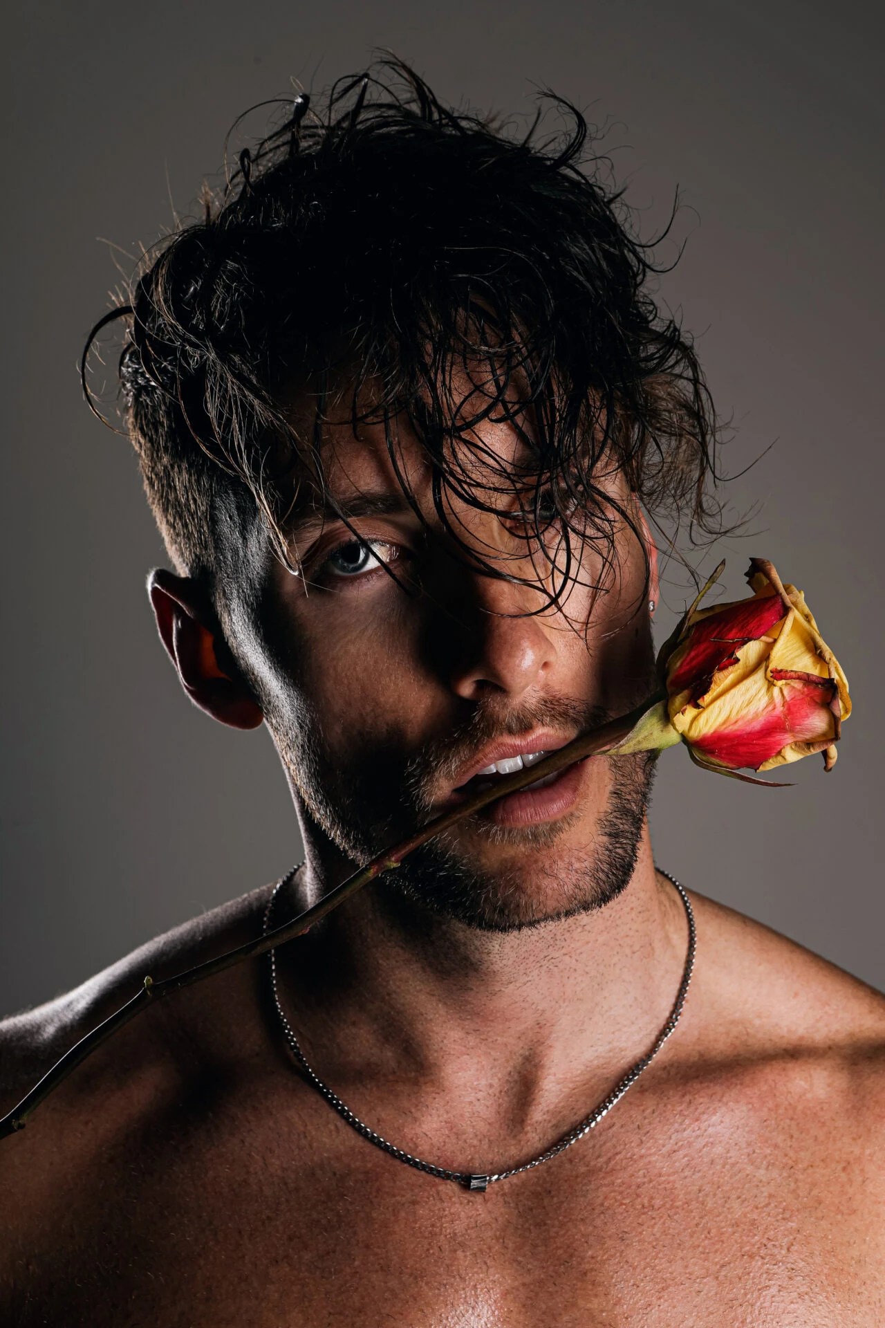 Editorial men's portrait, dramatic studio light