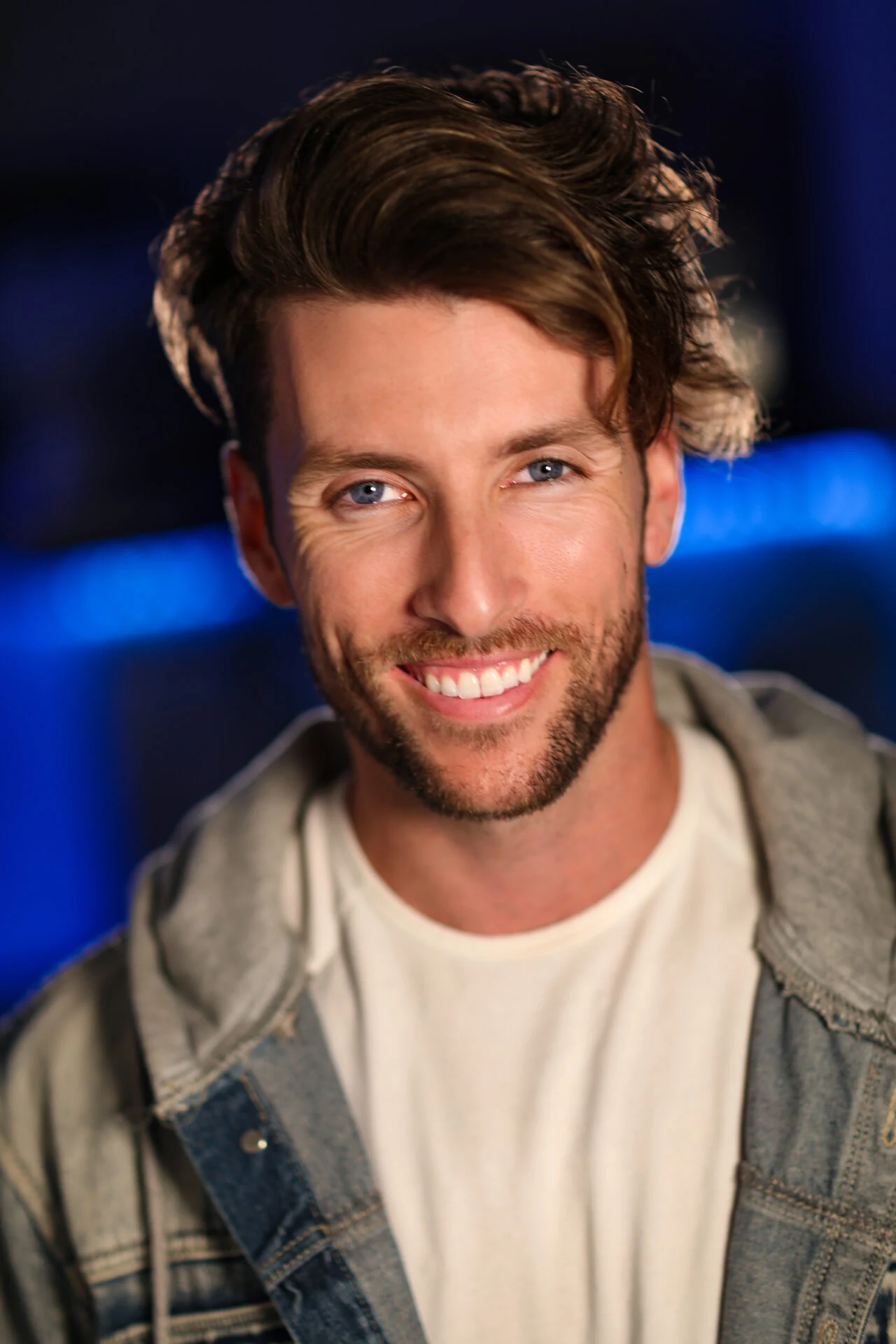 Actor headshot, denim jacket, warm light